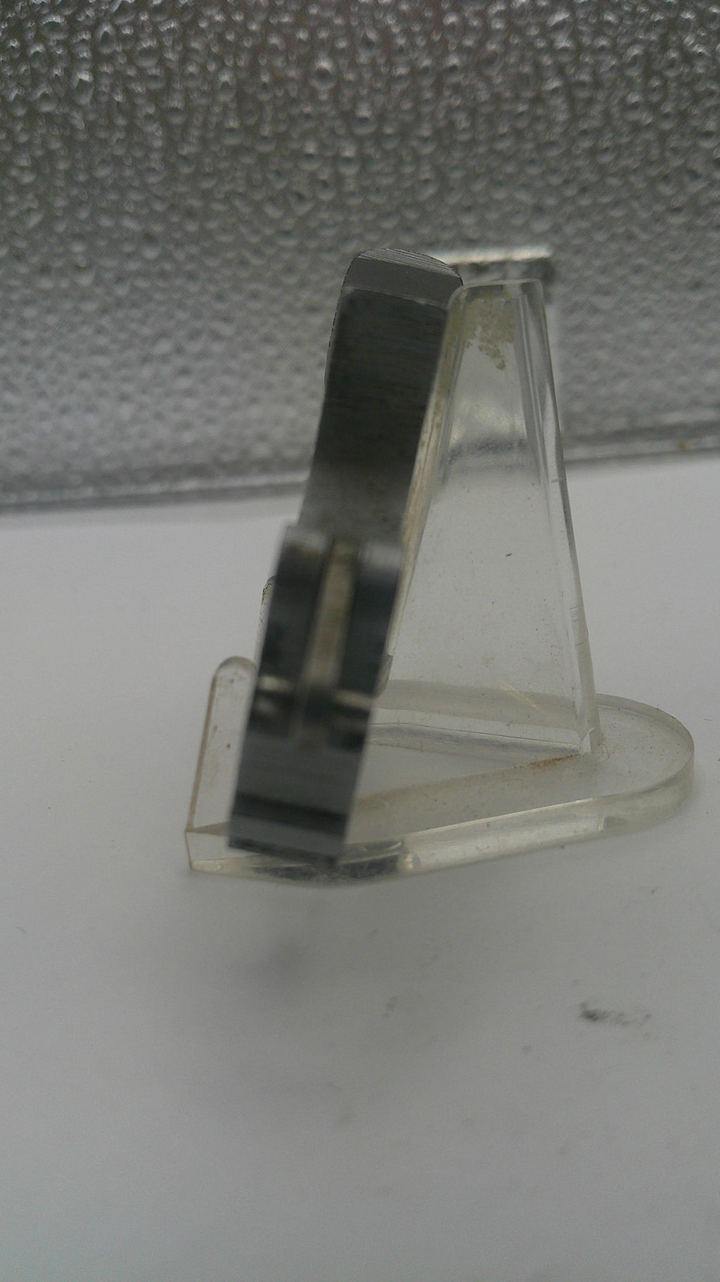 Clear plastic ring on a textured surface