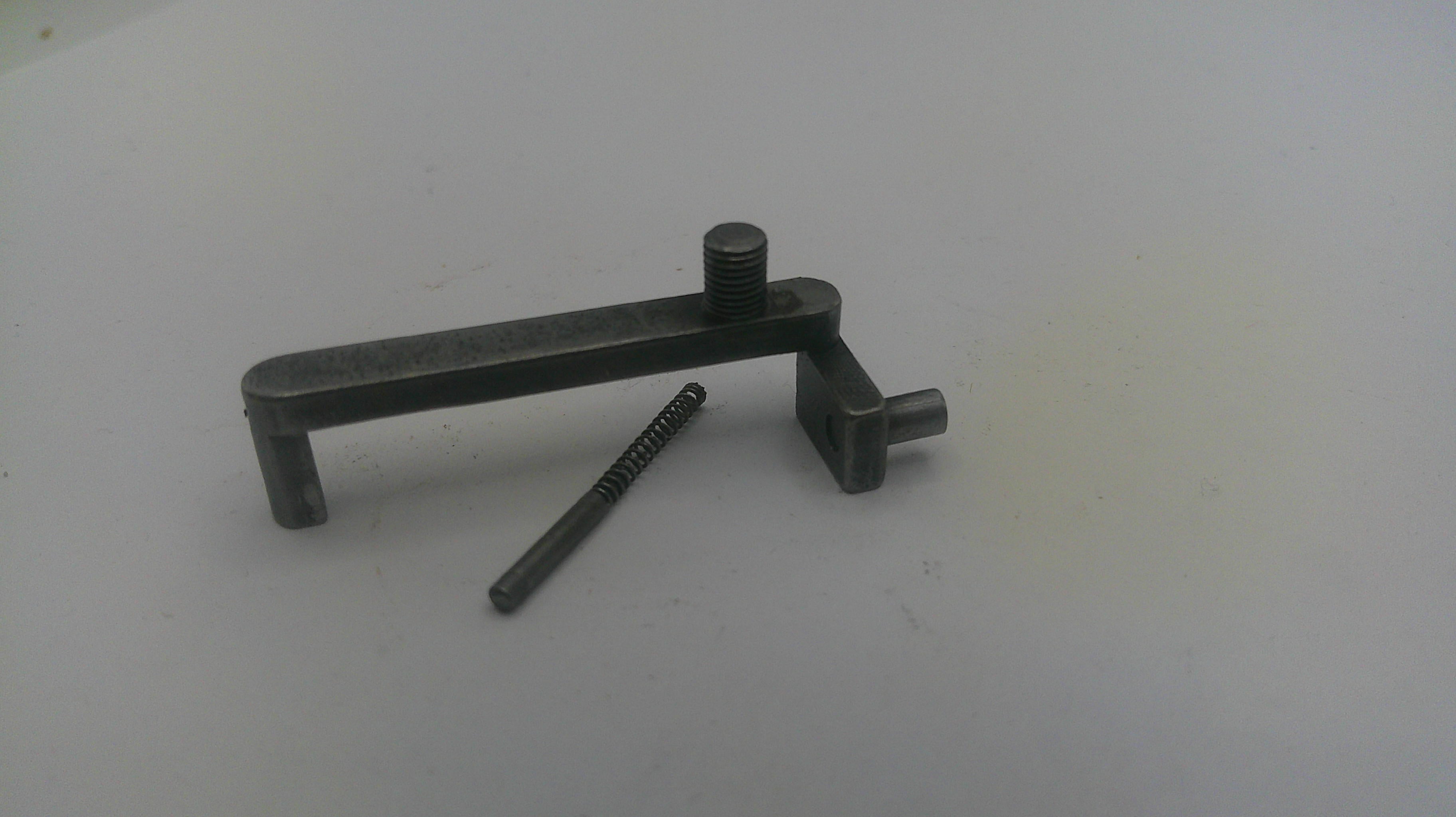 Metal tool with a screw on a white background