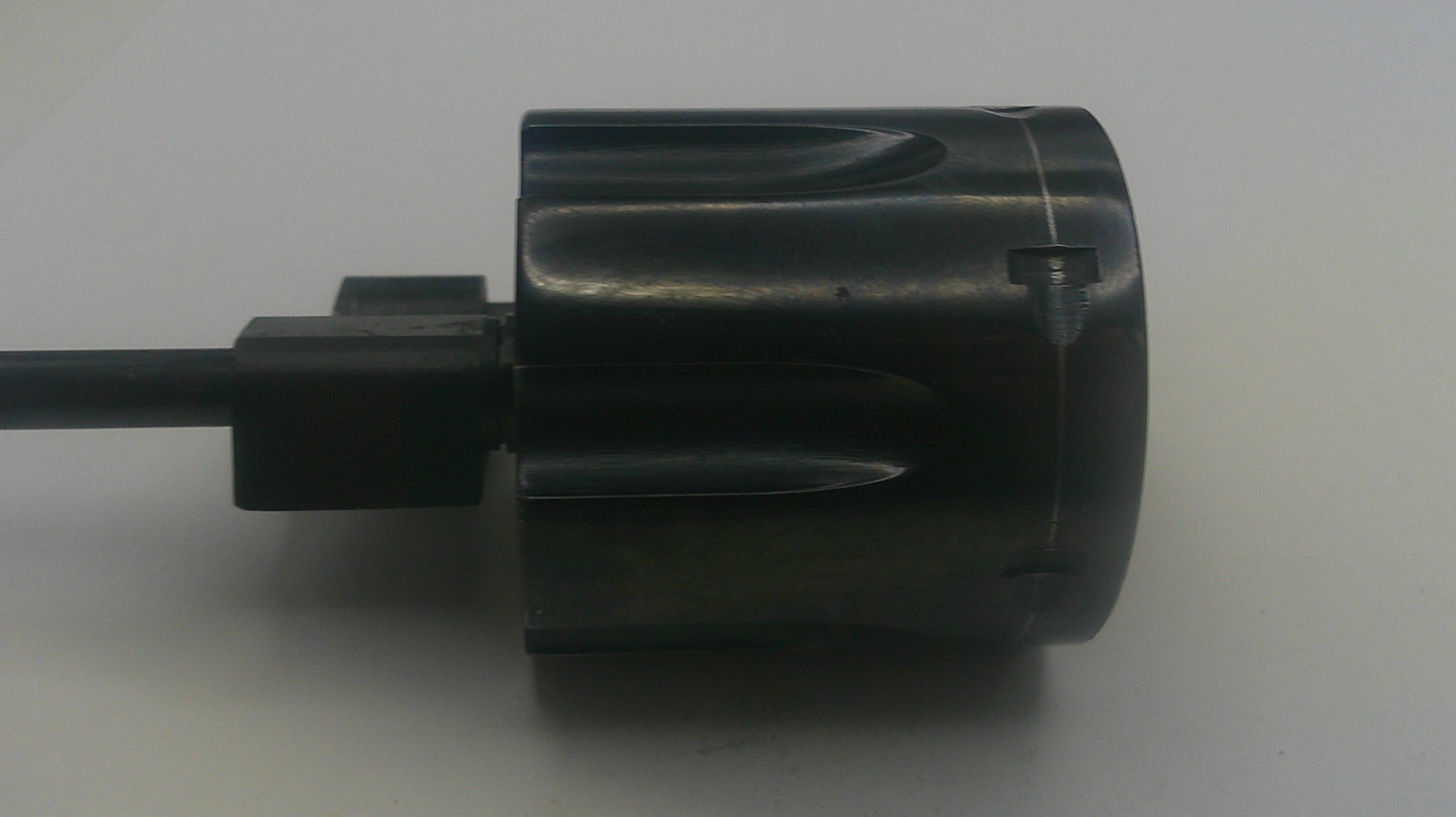 Black cylindrical object with a cable on a white background