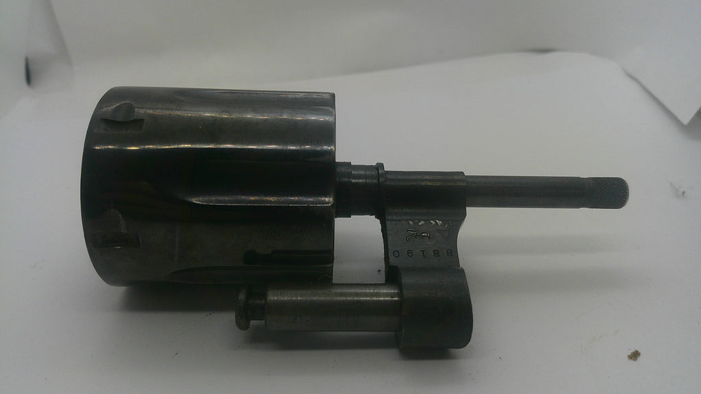 A dark metallic mechanical part, possibly a lock cylinder or tool component, photographed on a plain white background.