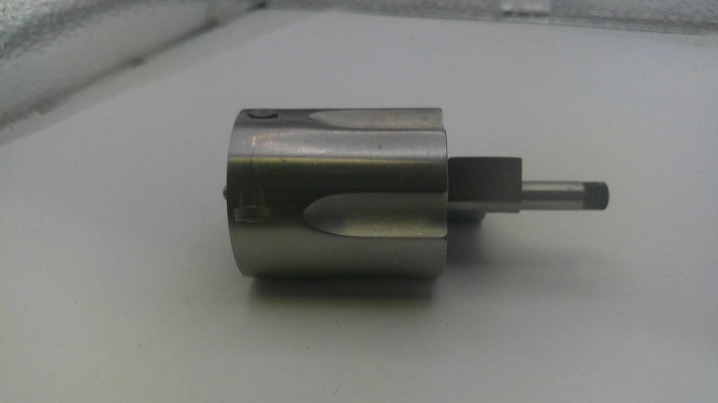 Metallic cylindrical object on a white surface