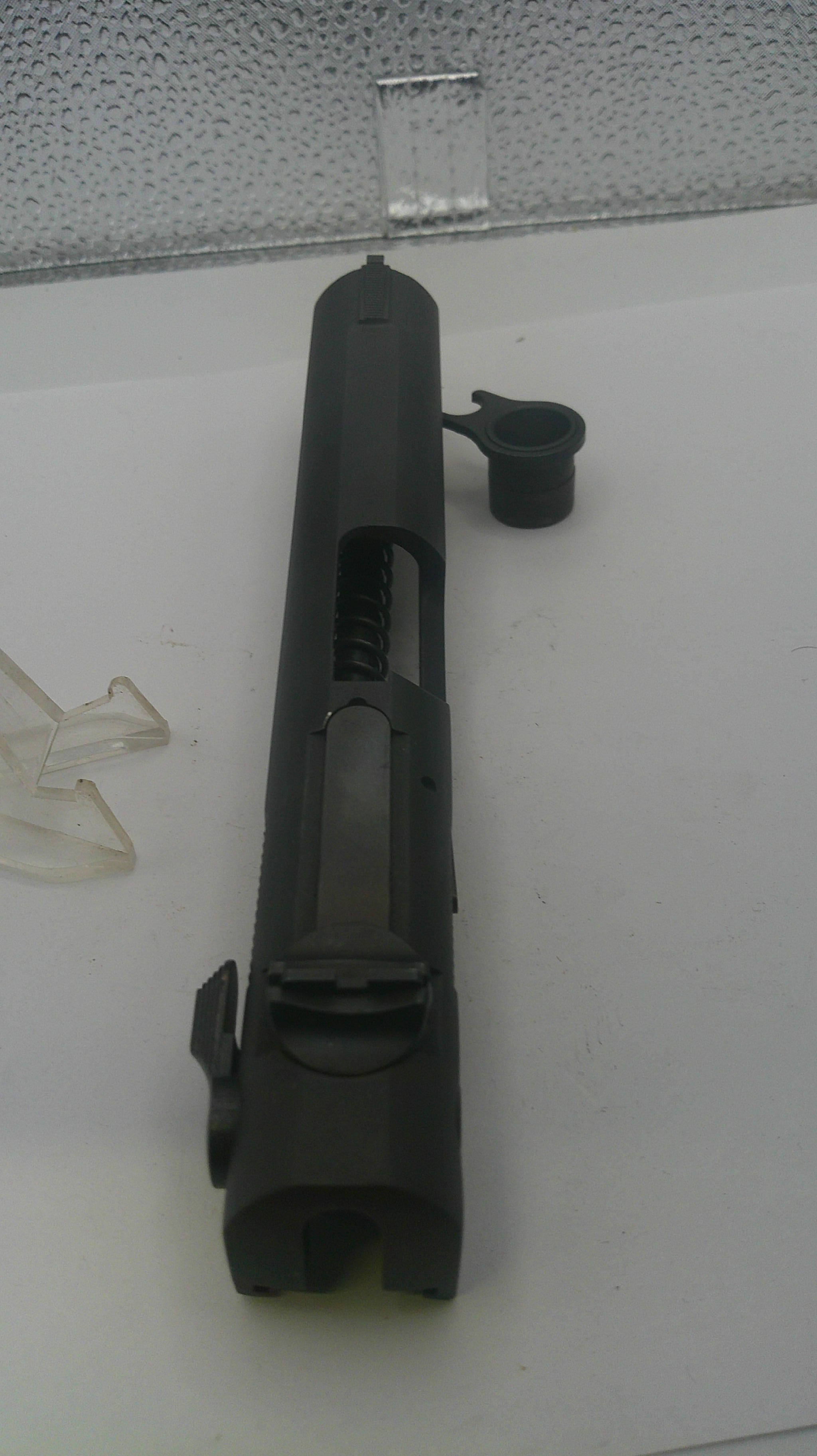 Black metal component on a white surface