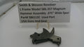Smith & Wesson revolver hammer assembly on a white background with a label.