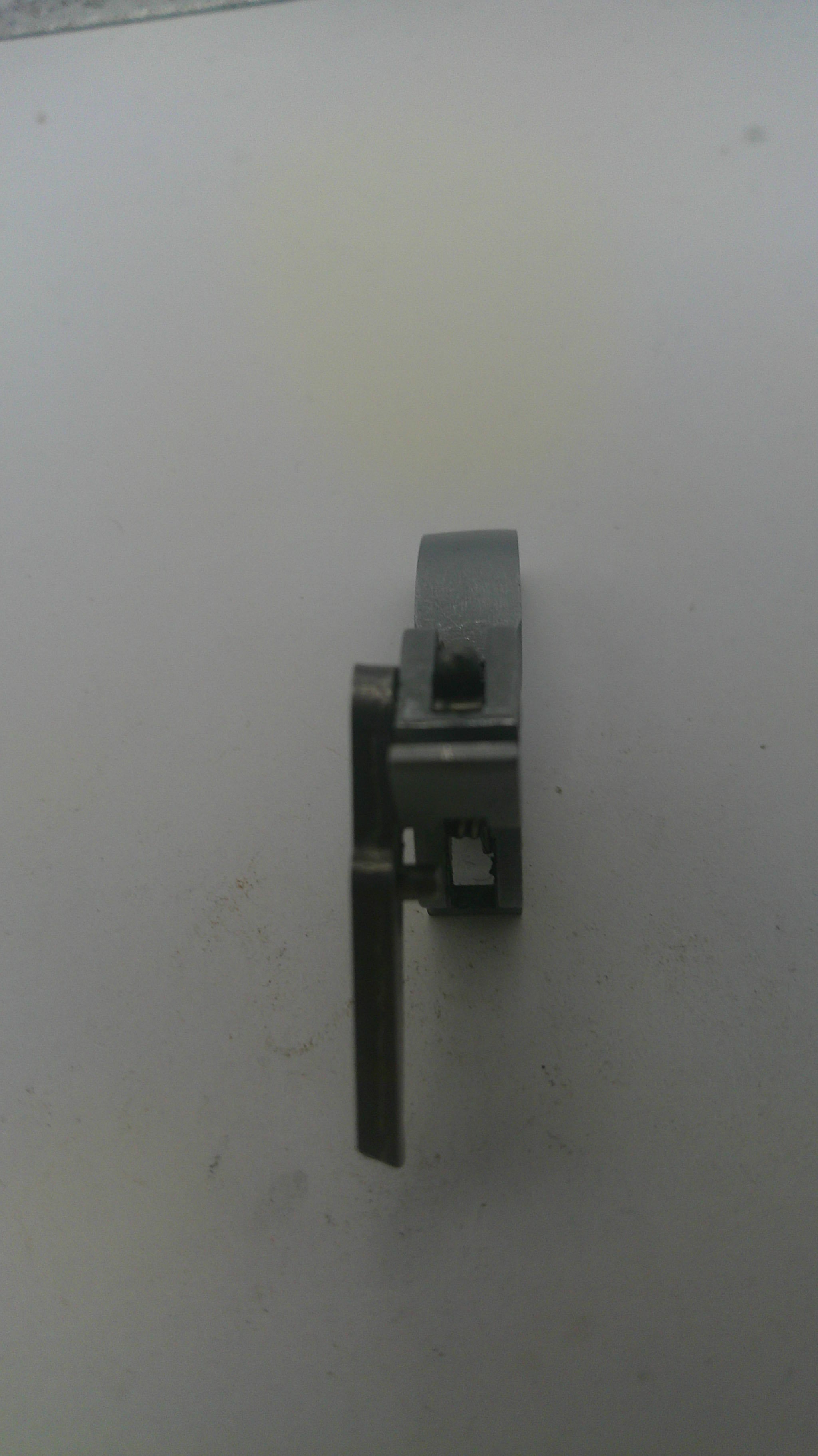 Metallic window latch on a white background