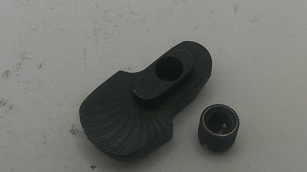 Black metal mechanical component on a white background