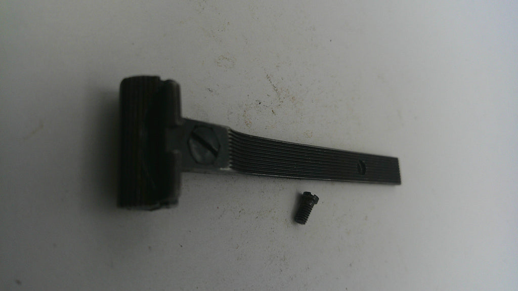 Black brush and handle on a white surface