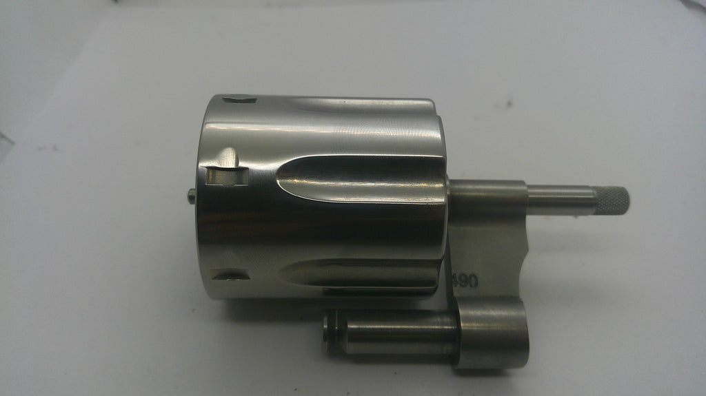 A metallic cylindrical mechanical component with a polished silver finish, featuring a protruding shaft and mounting bracket, photographed on a plain light background.
