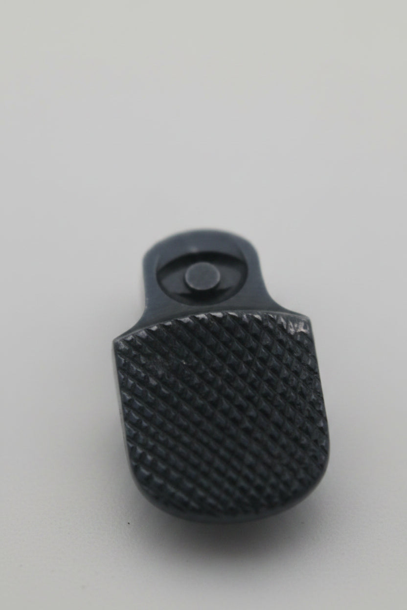A small black textured plastic or rubber component with a cylindrical opening, shown on a plain light background.