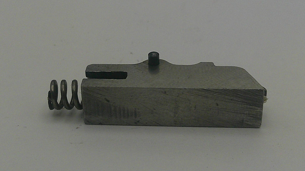 Mechanical component with a spring on a gray background