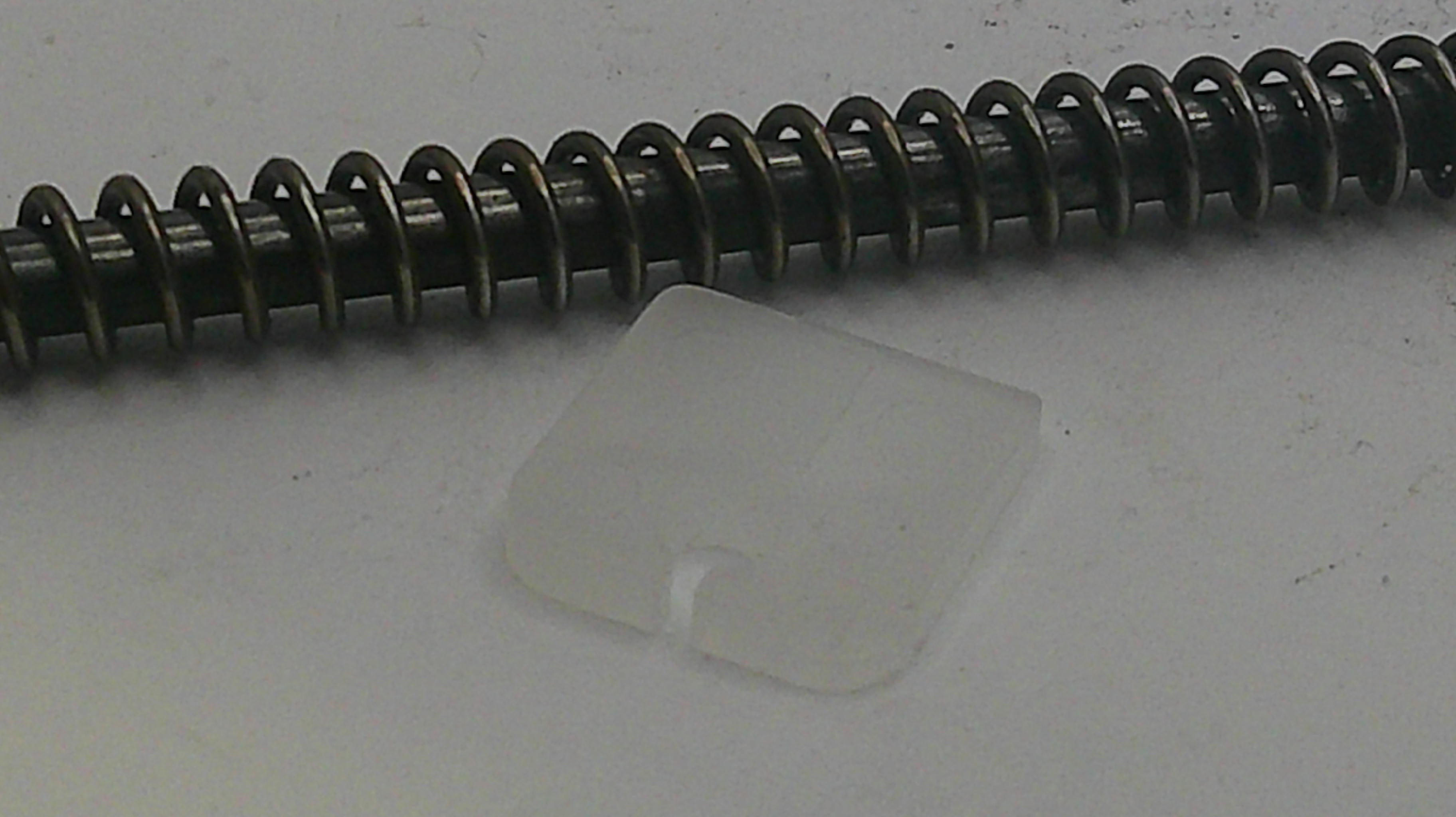 Metallic spring on a white background