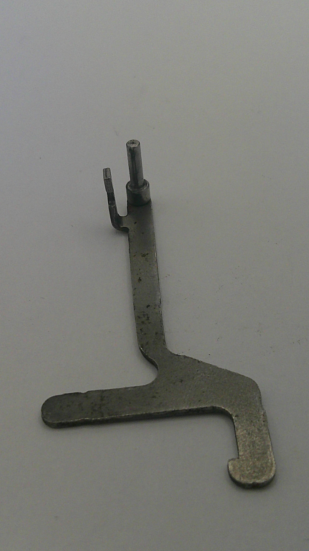 Metal tool on a gray background