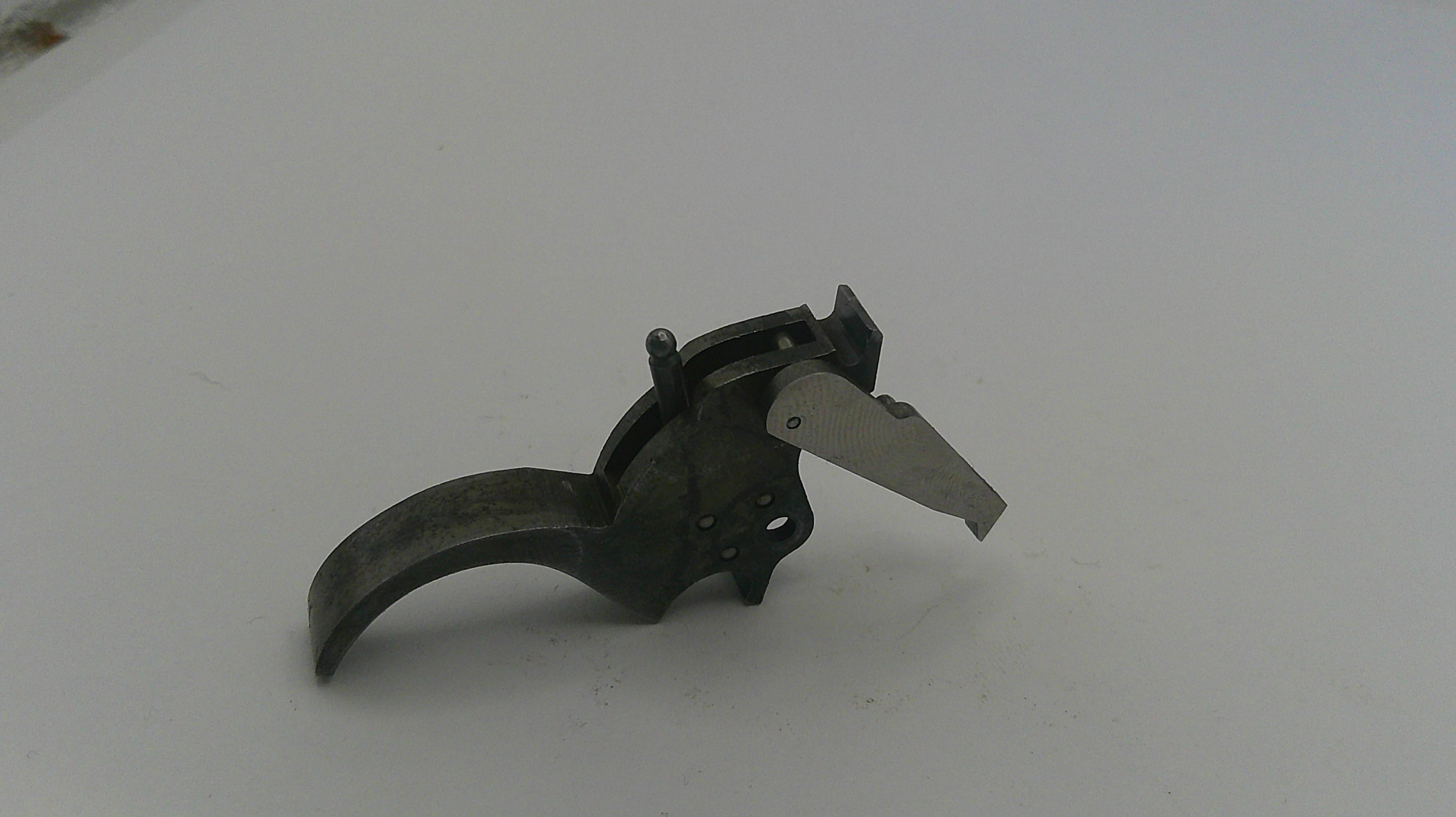 Metallic object with a blade on a white background