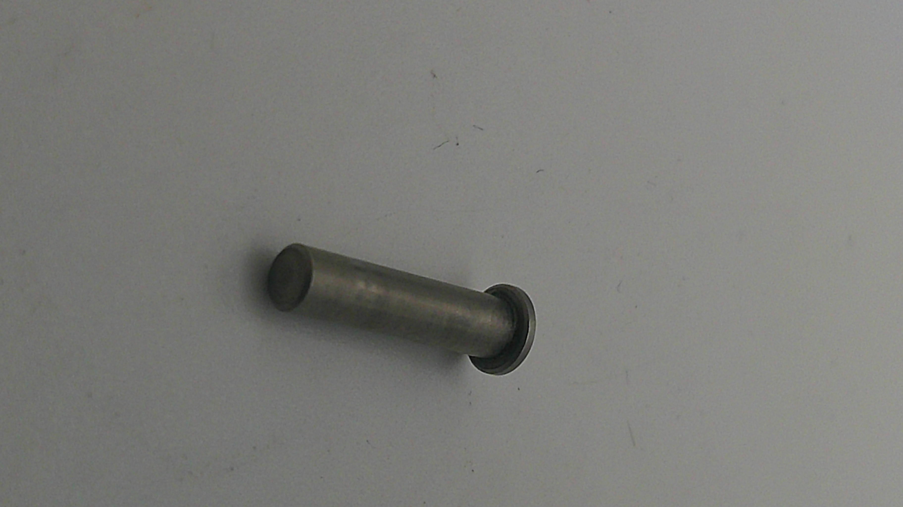 Metal cylindrical object on a plain background