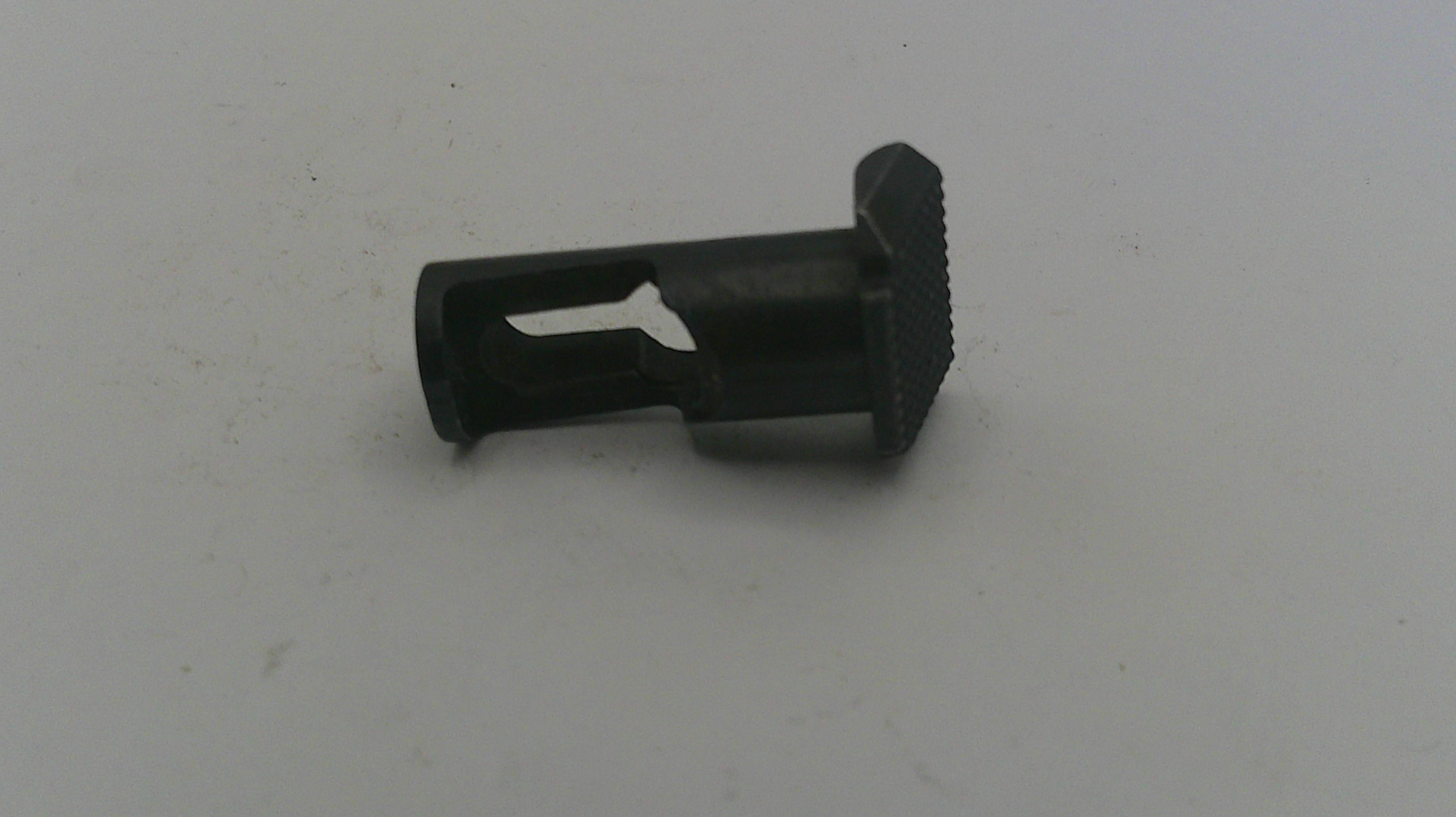 Black plastic component on a white background
