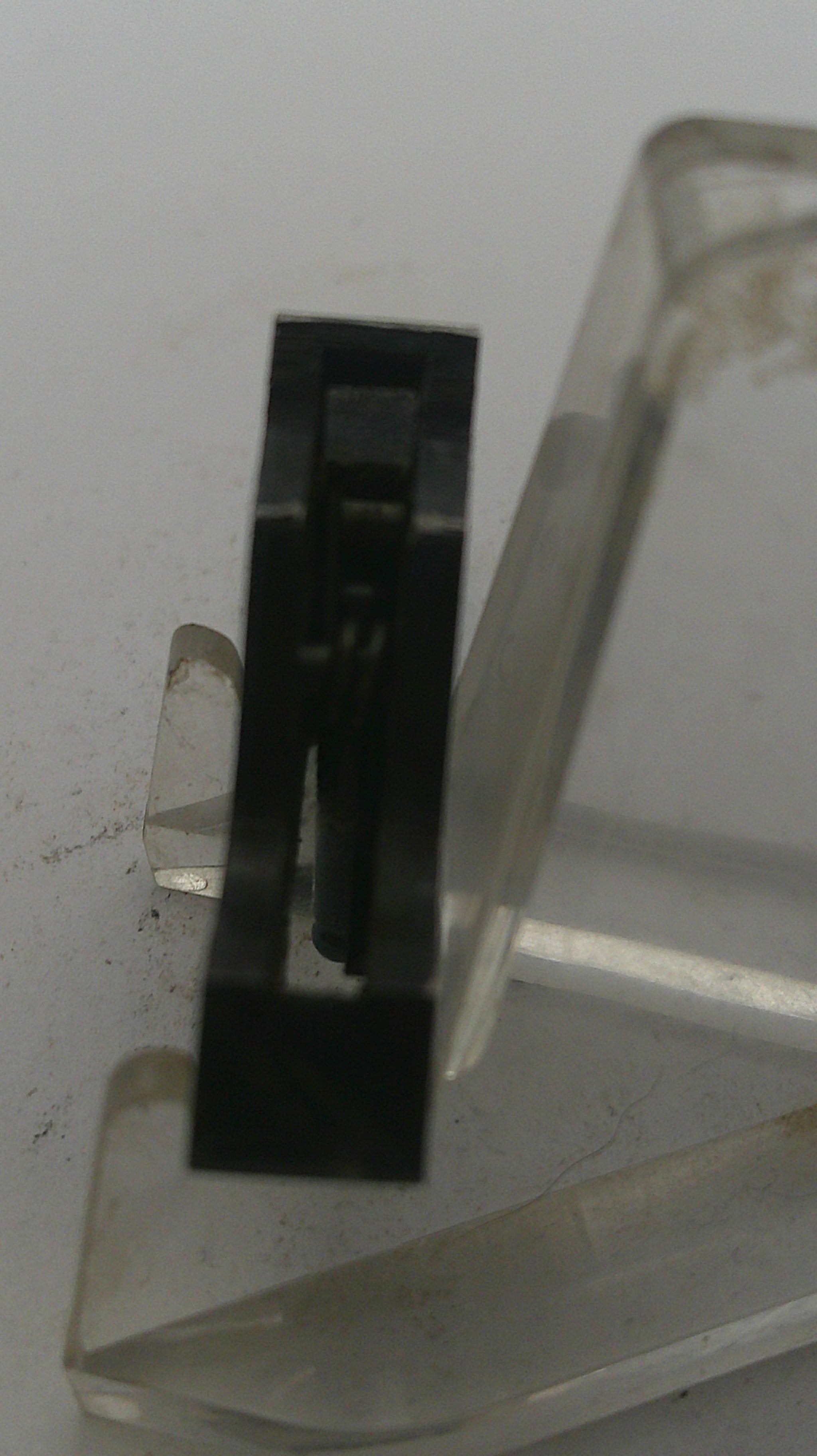 Close-up of a metallic handle on a door with a blurred background