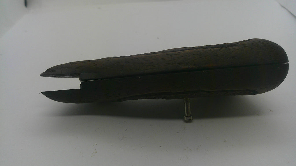 A dark brown wooden box with a carved textured lid, shown open on a plain white surface.