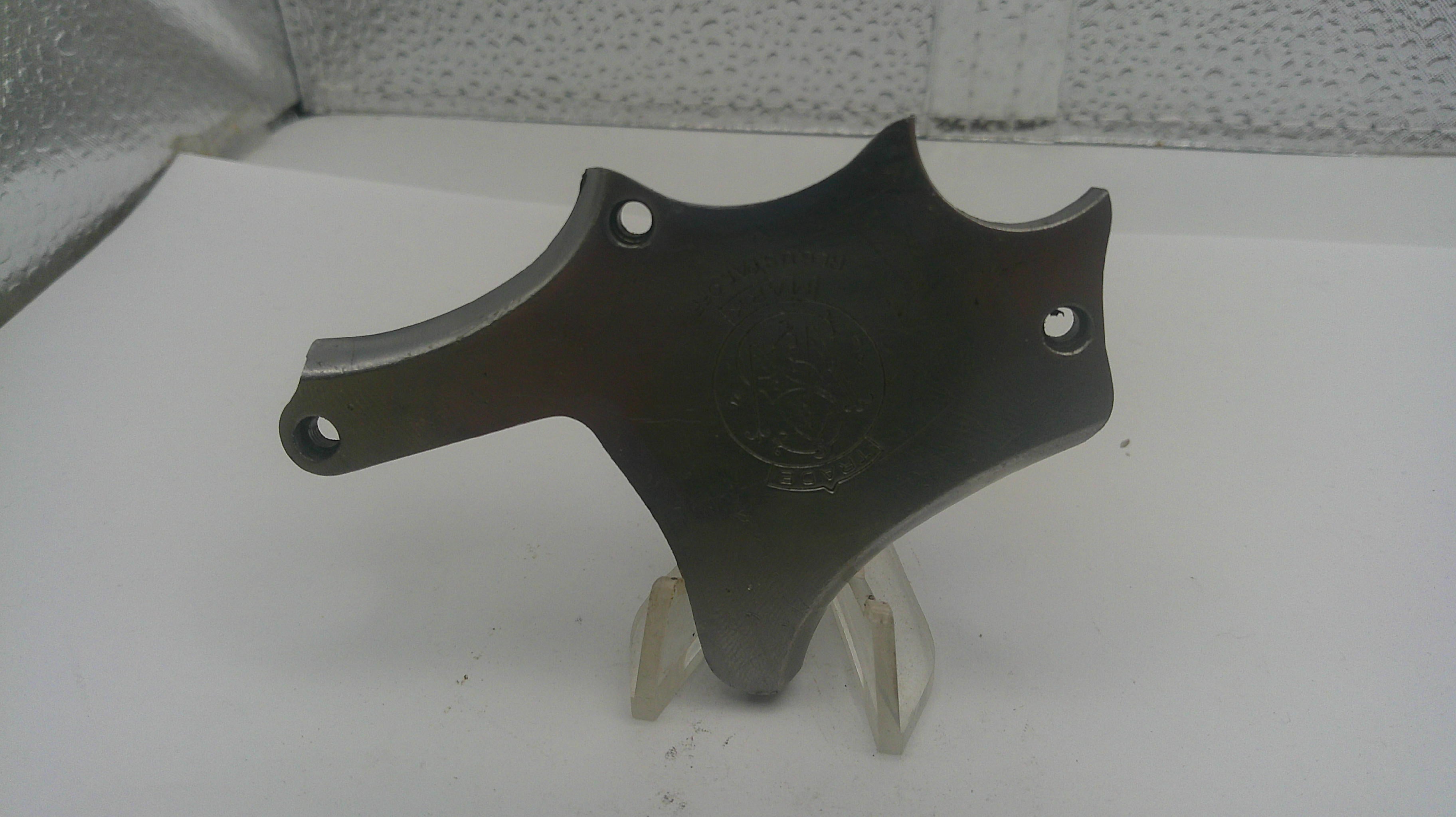 Black metal bracket on a stand against a white background