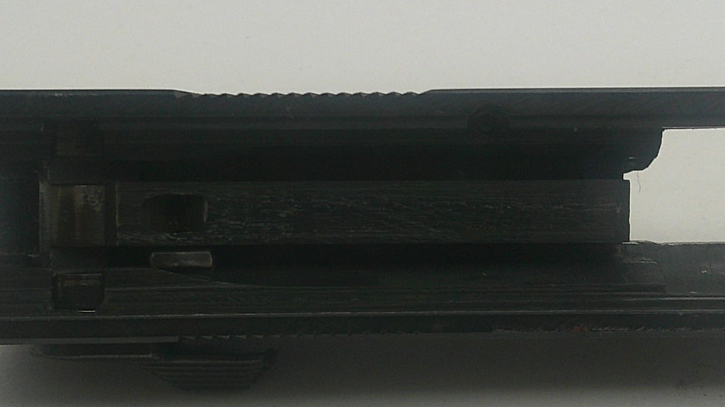 Close-up of a black electronic device with a white background