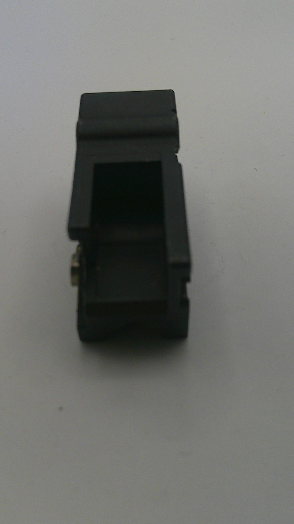Black mechanical component on a white background