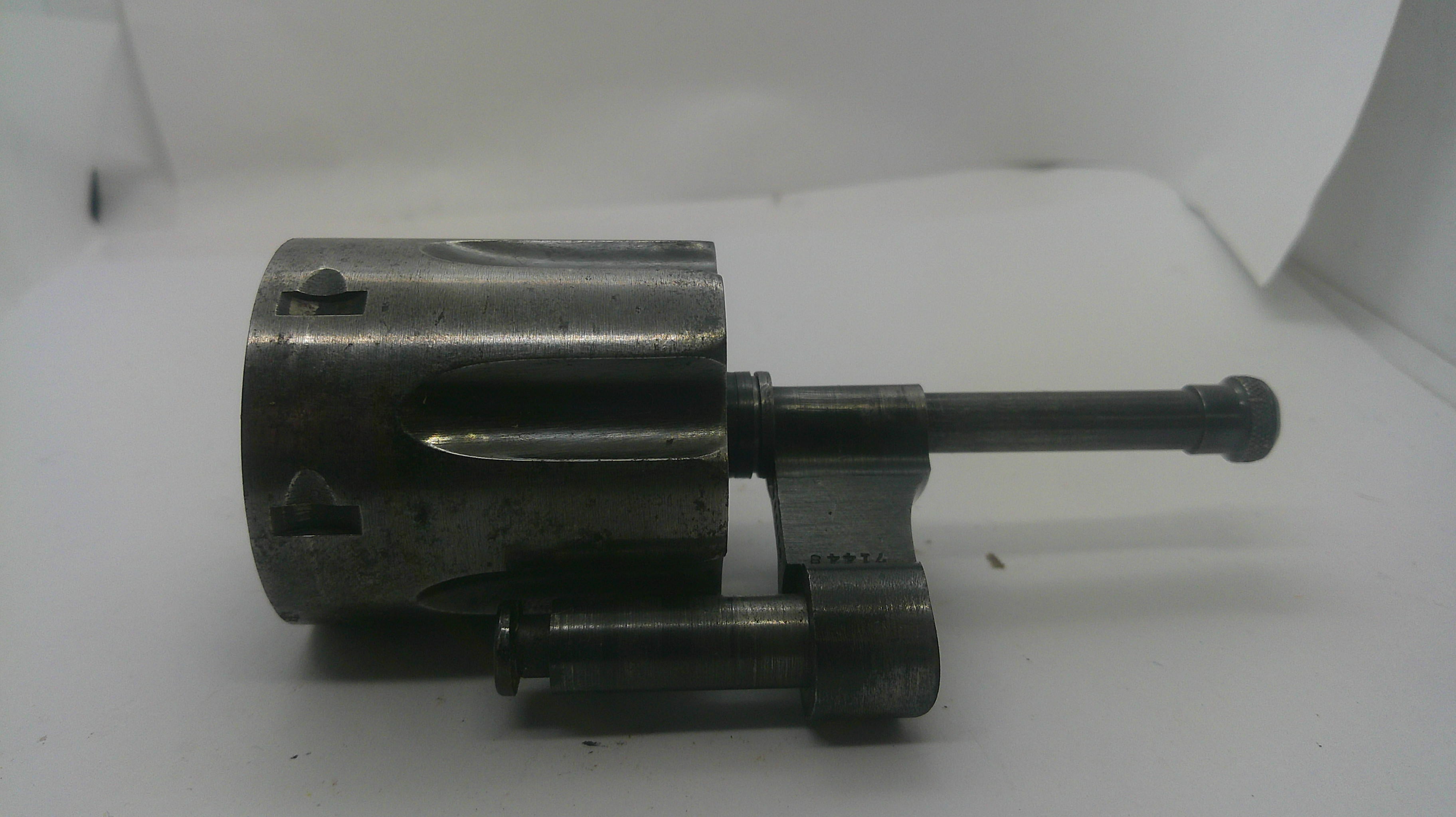A used metal mechanical part, likely a valve stem or camshaft component, with a cylindrical body and a protruding rod, shown on a white background.