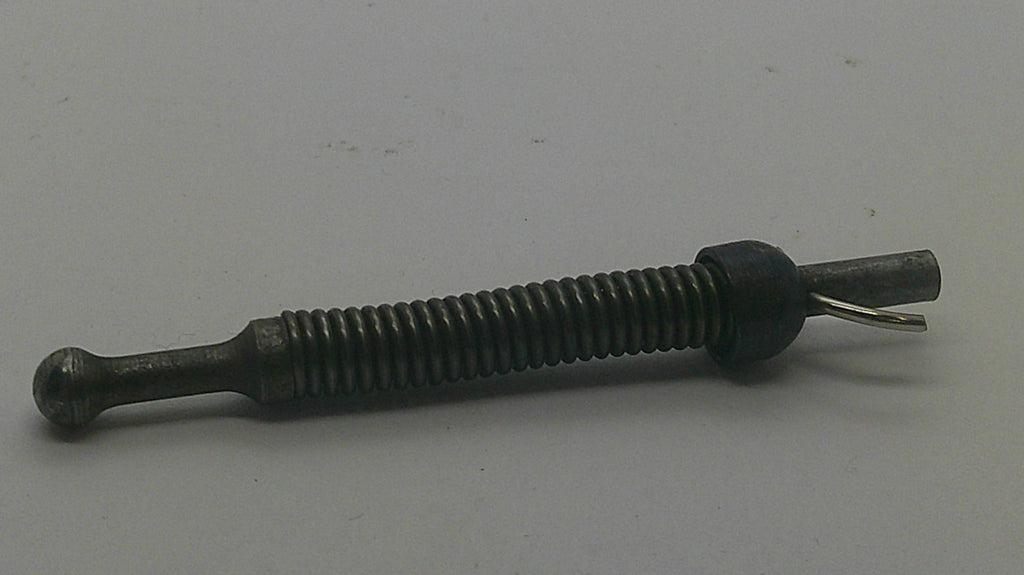 A small metal mechanical component, possibly a threaded rod or pin with a dark plastic collar and a small wire loop, shown on a plain light gray background.