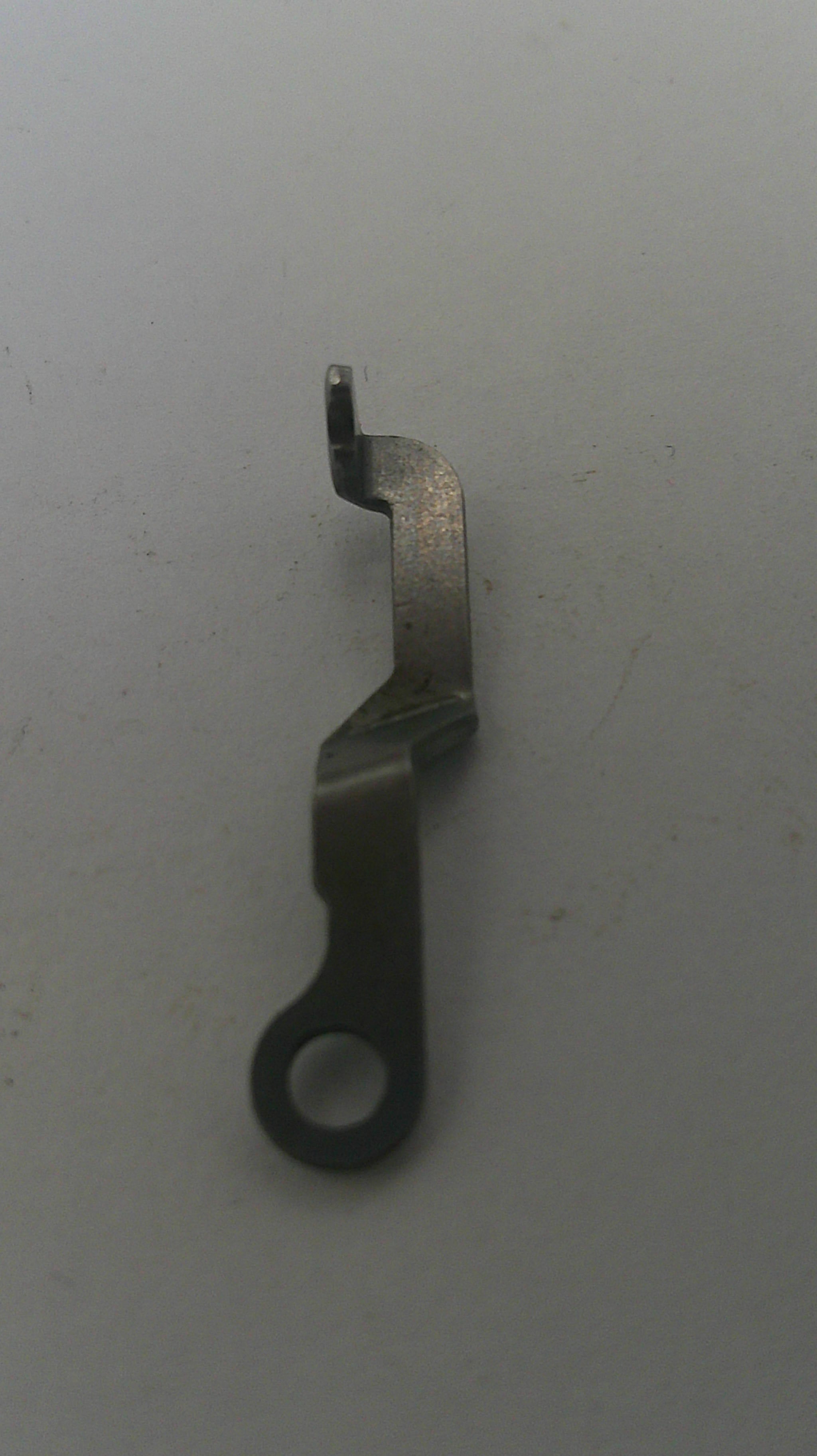 Metal tool on a gray background
