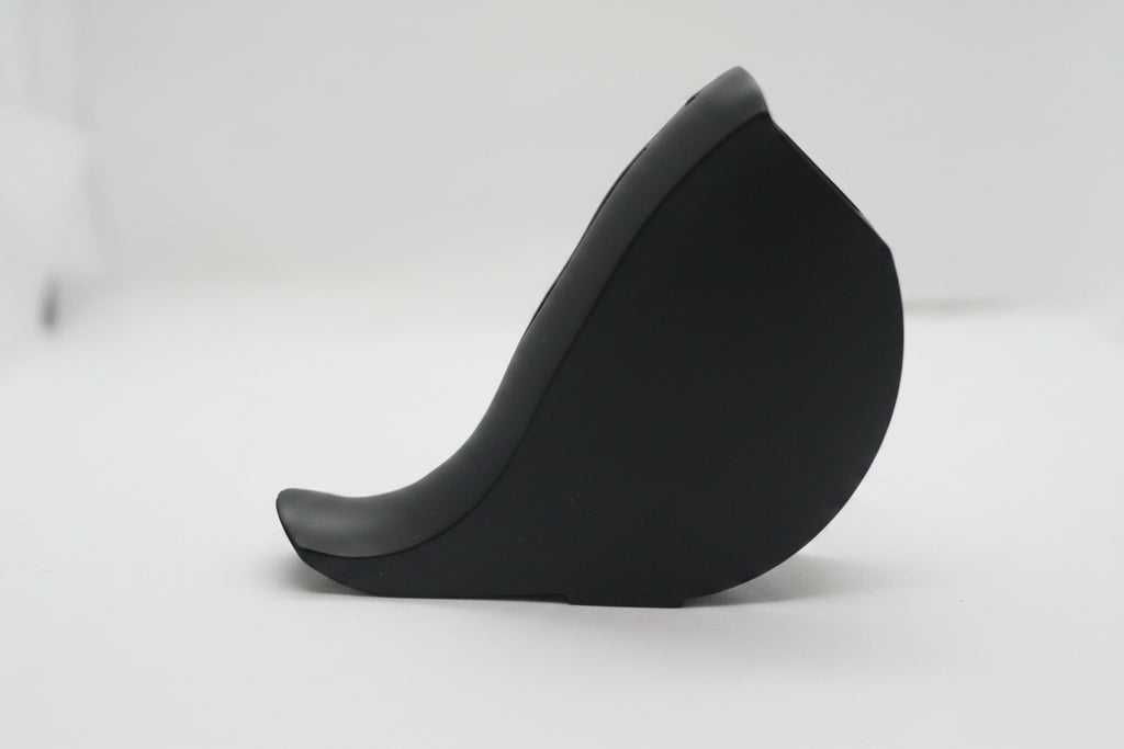 A black curved hat or cap shown on a plain white background, but the image is heavily blurred and not clearly identifiable.