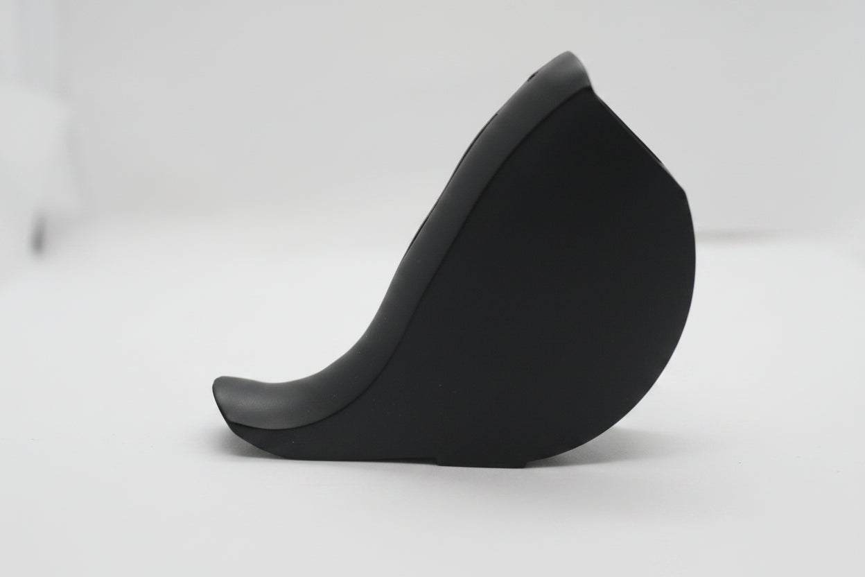 A black curved hat or cap shown on a plain white background, but the image is heavily blurred and not clearly identifiable.