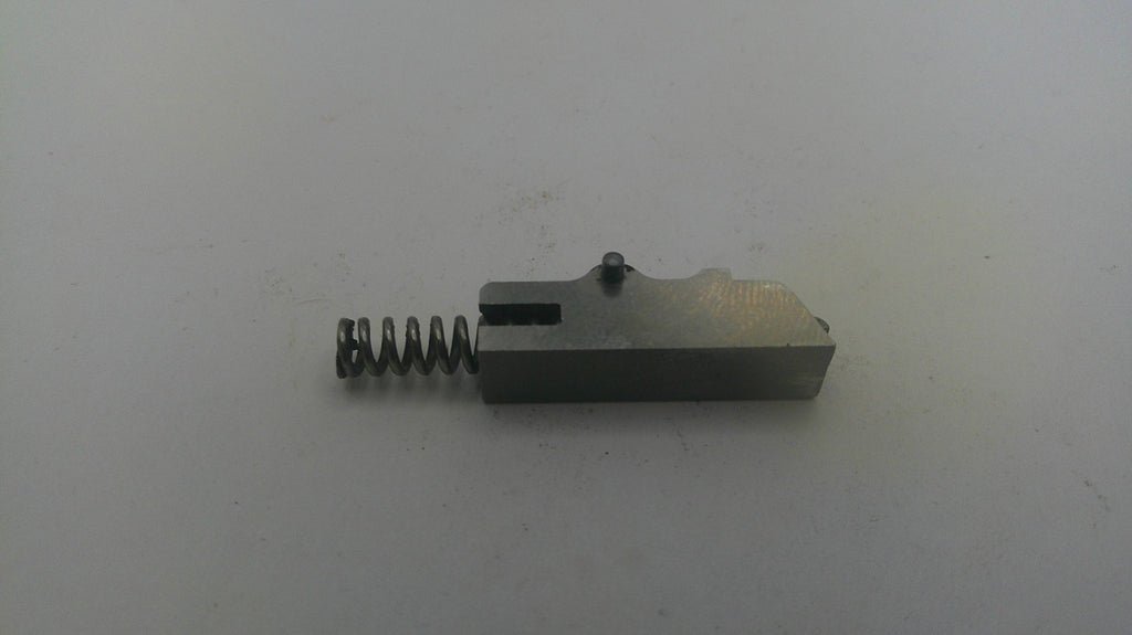 Metal component with a spring on a white background