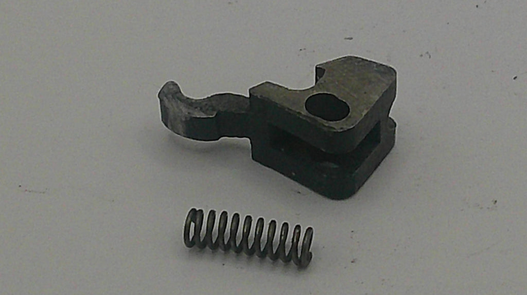 Metal component with a spring on a white background