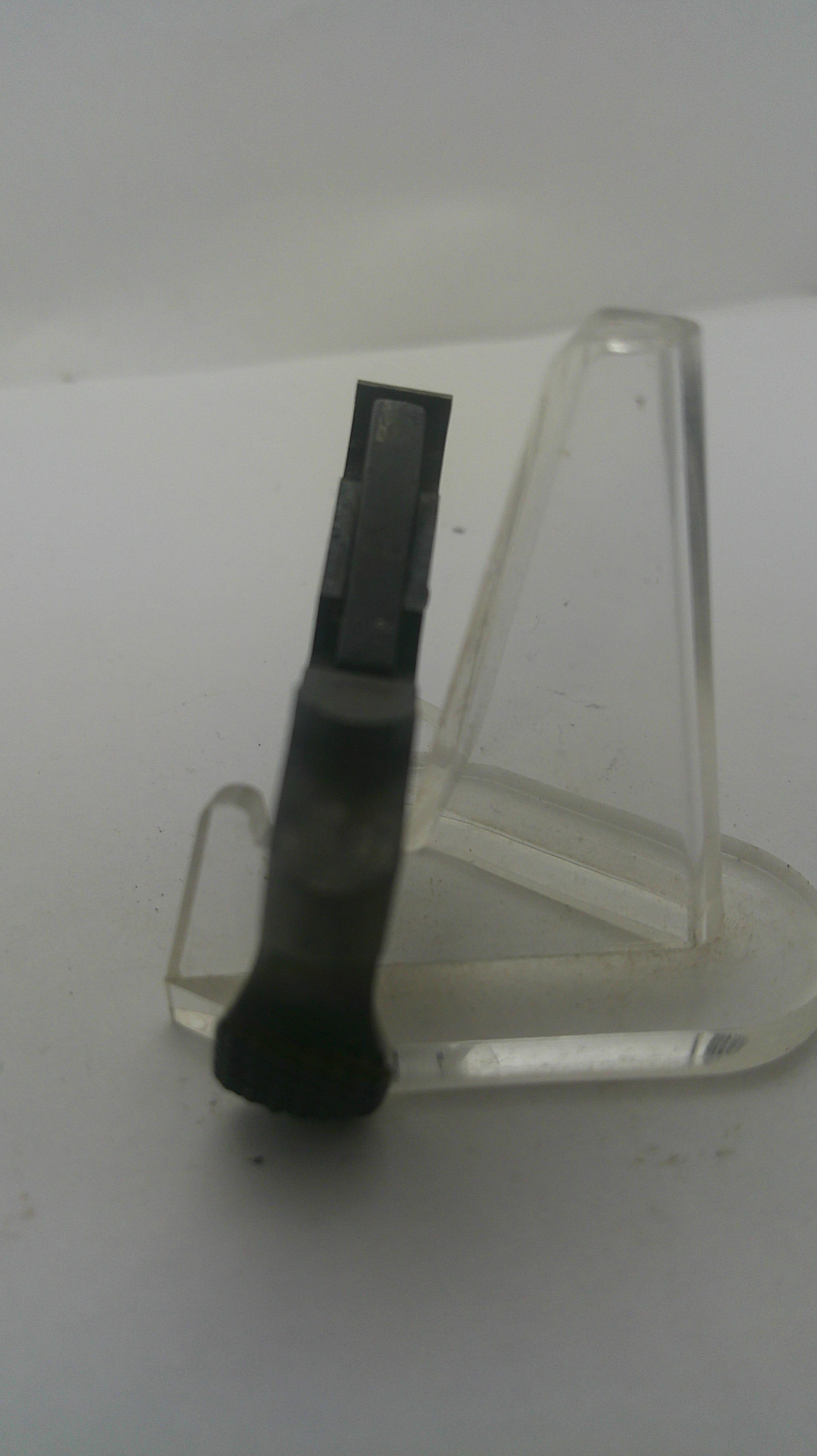 A black rectangular replacement part with a translucent clear plastic holder, shown against a plain white background.