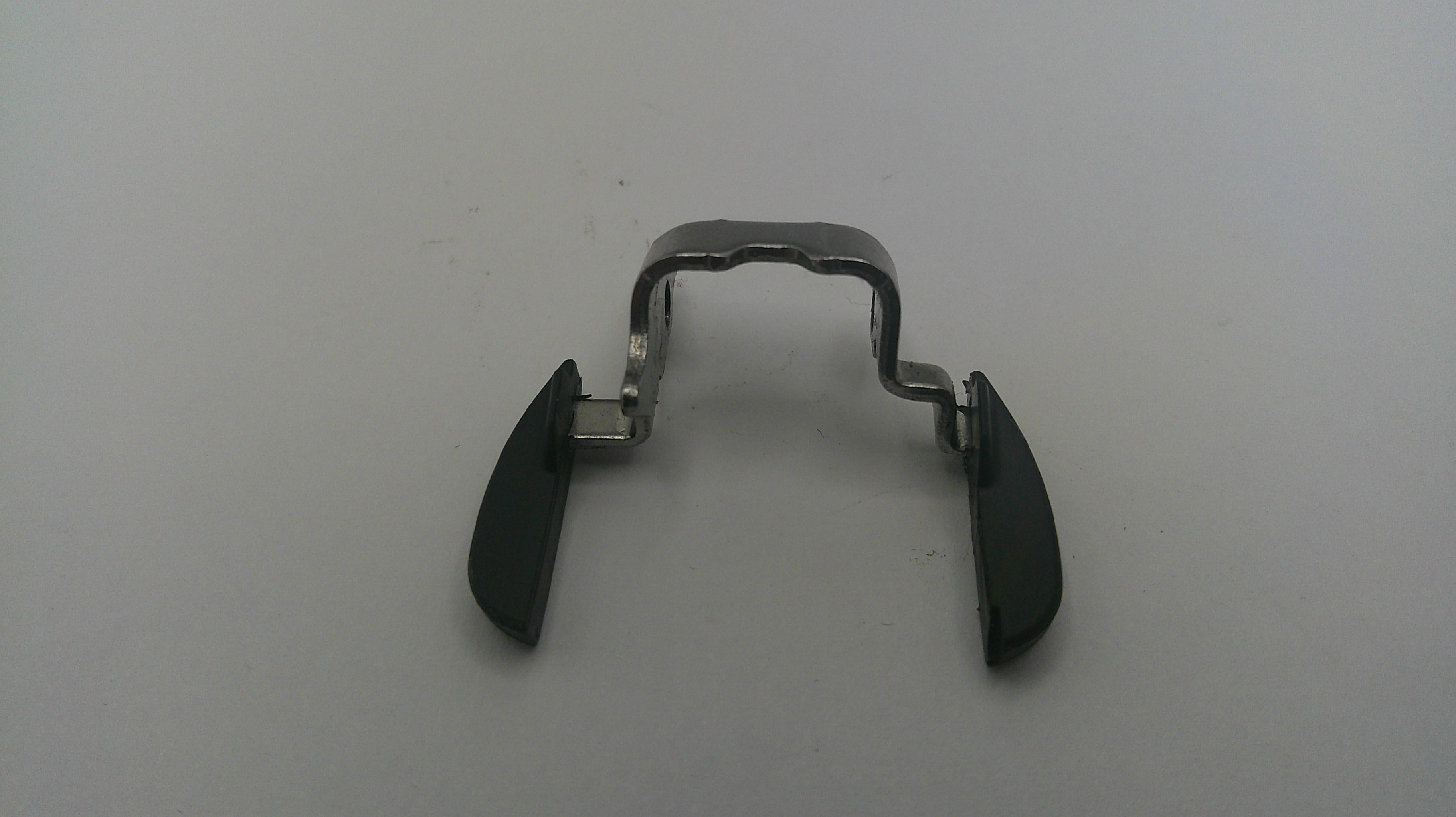 Metal clip with black plastic covers on a white background