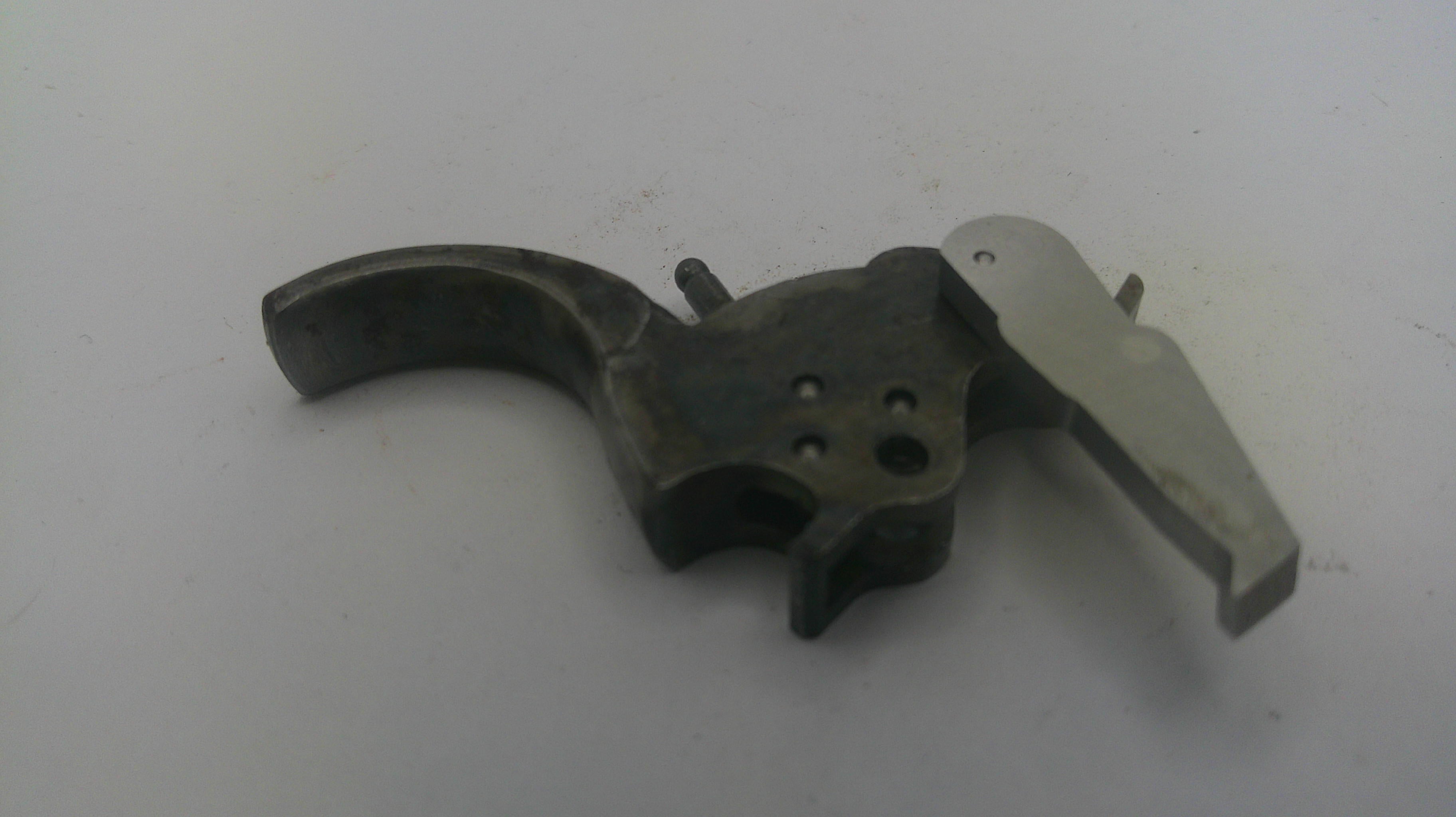 Metallic gun part on a white background