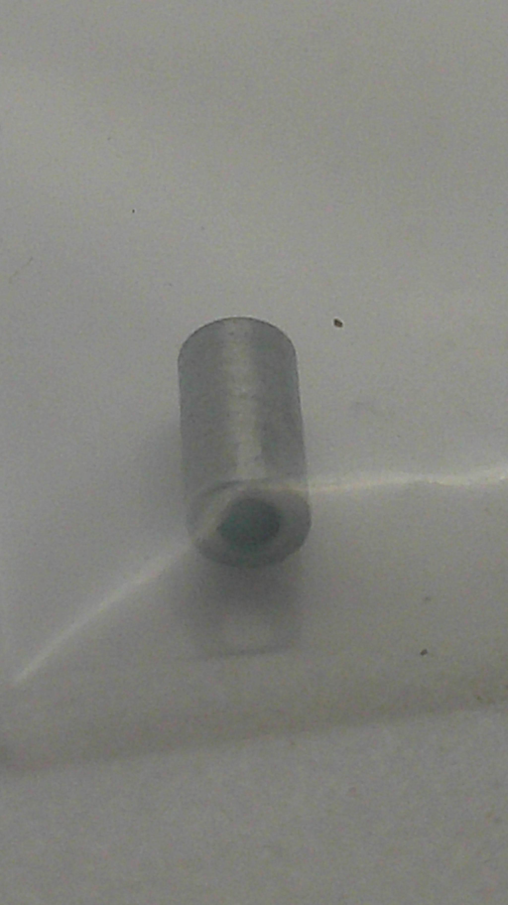 A small metallic cylindrical component with a tapered tip, shown against a plain light gray background.