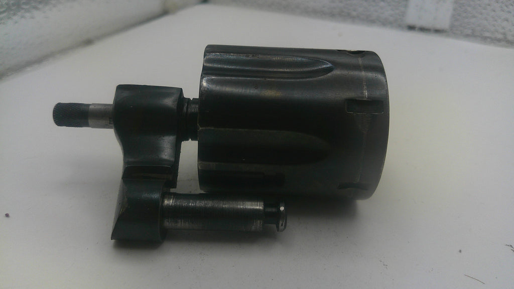Black metal component on a white surface