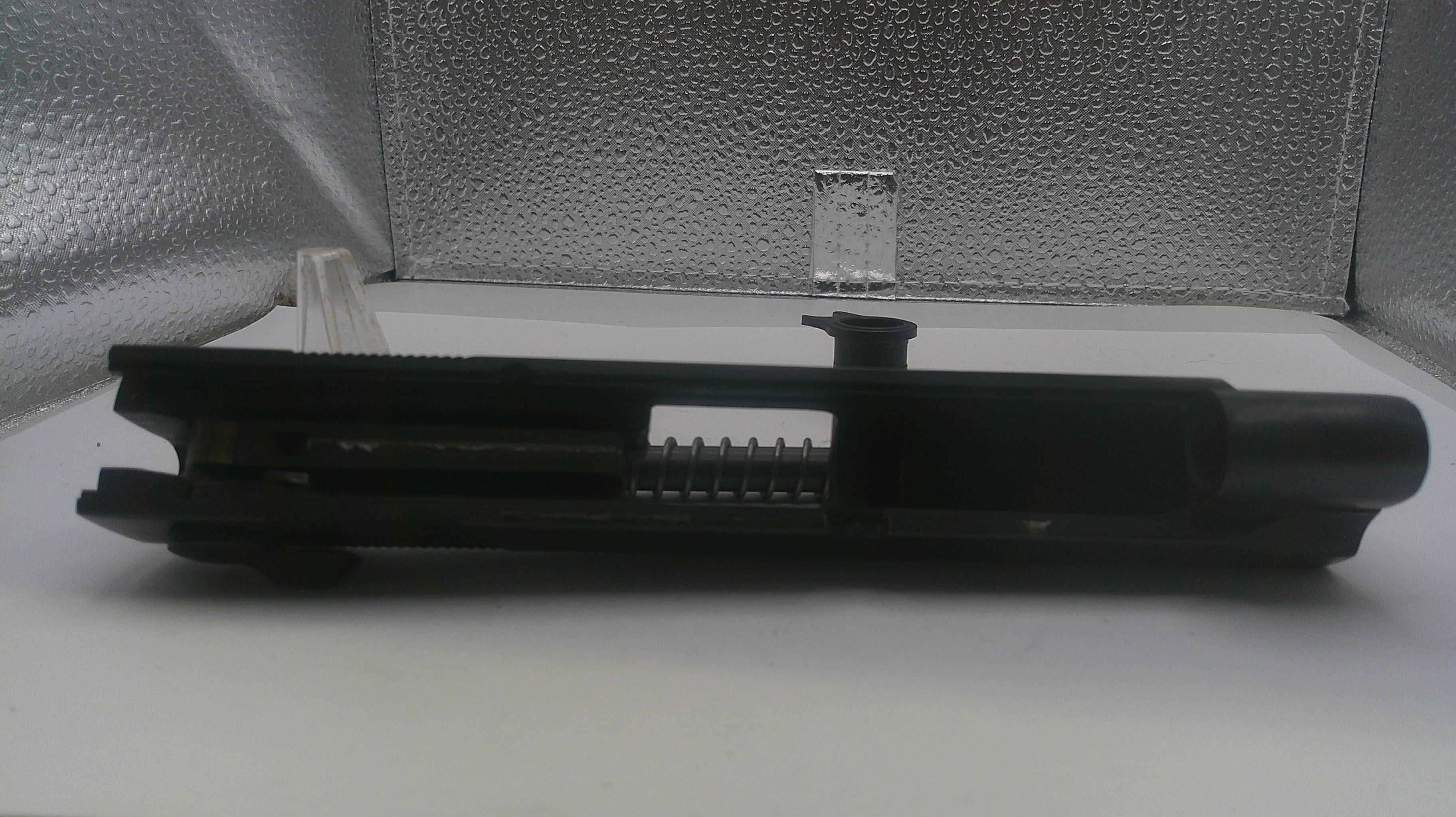 Black metal component on a textured white surface