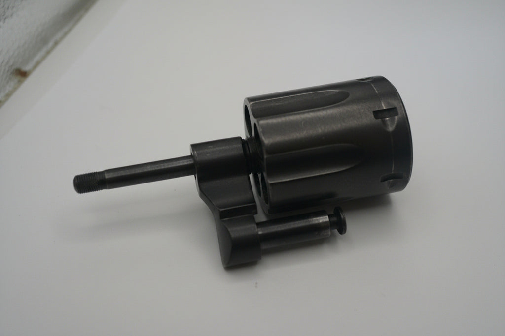 Black cylindrical object on a white surface