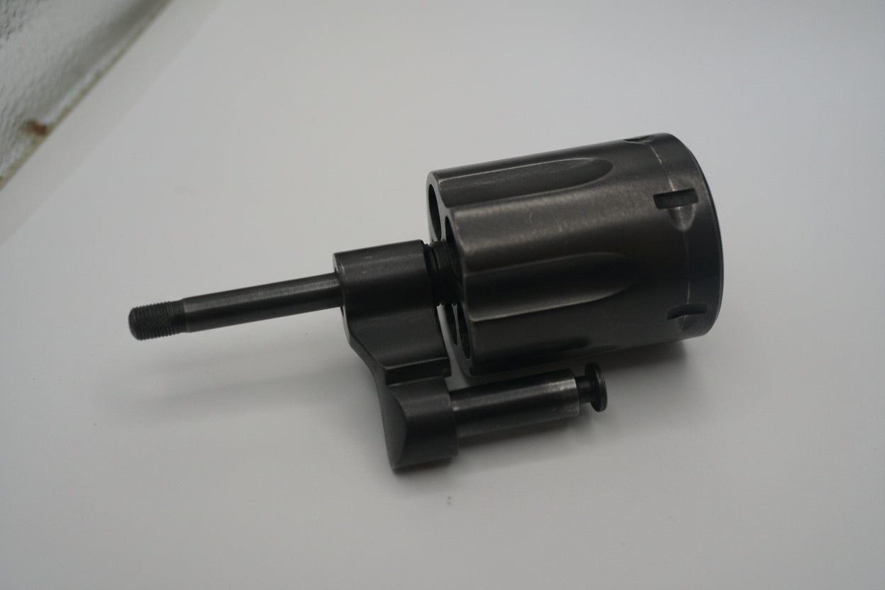 Black cylindrical object on a white surface