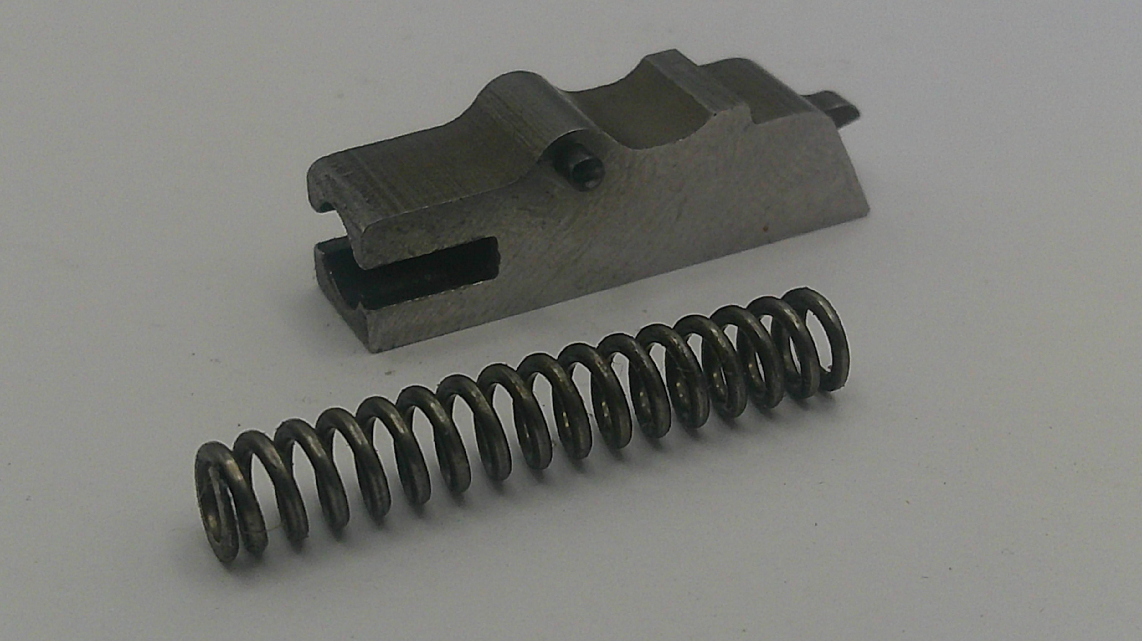 Metal spring and mechanical component on a gray background