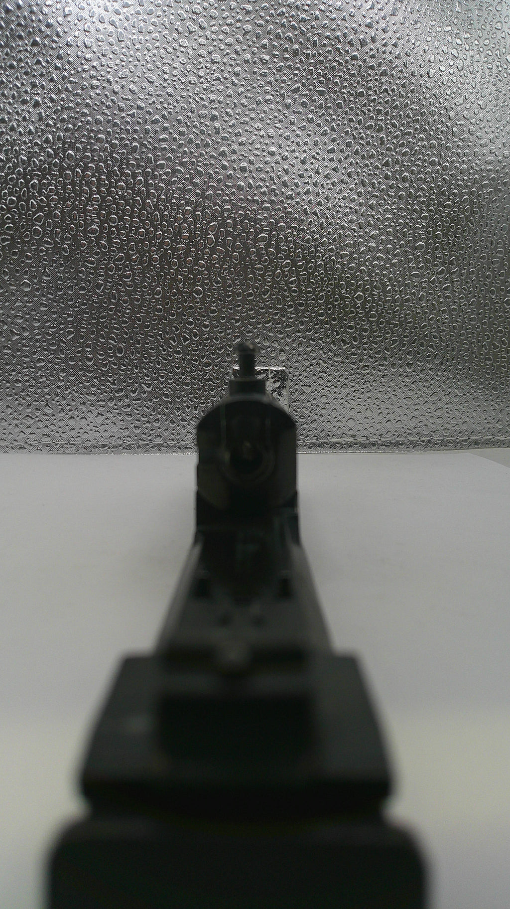 Close-up of a drill bit on a textured surface