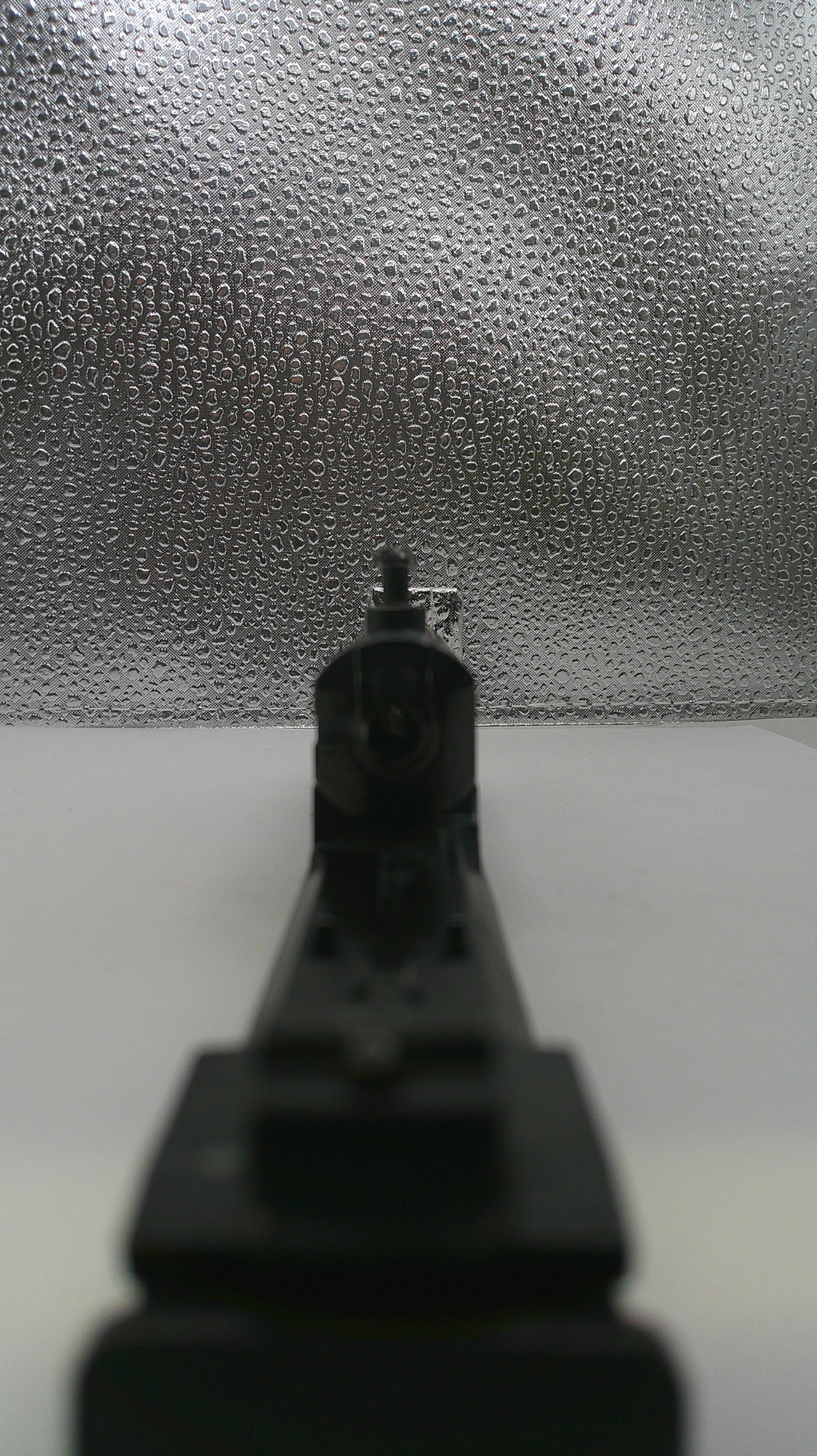 Close-up of a drill bit on a textured surface