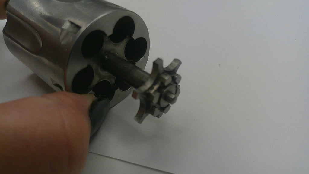 Close-up of a revolver's cylinder on a white background