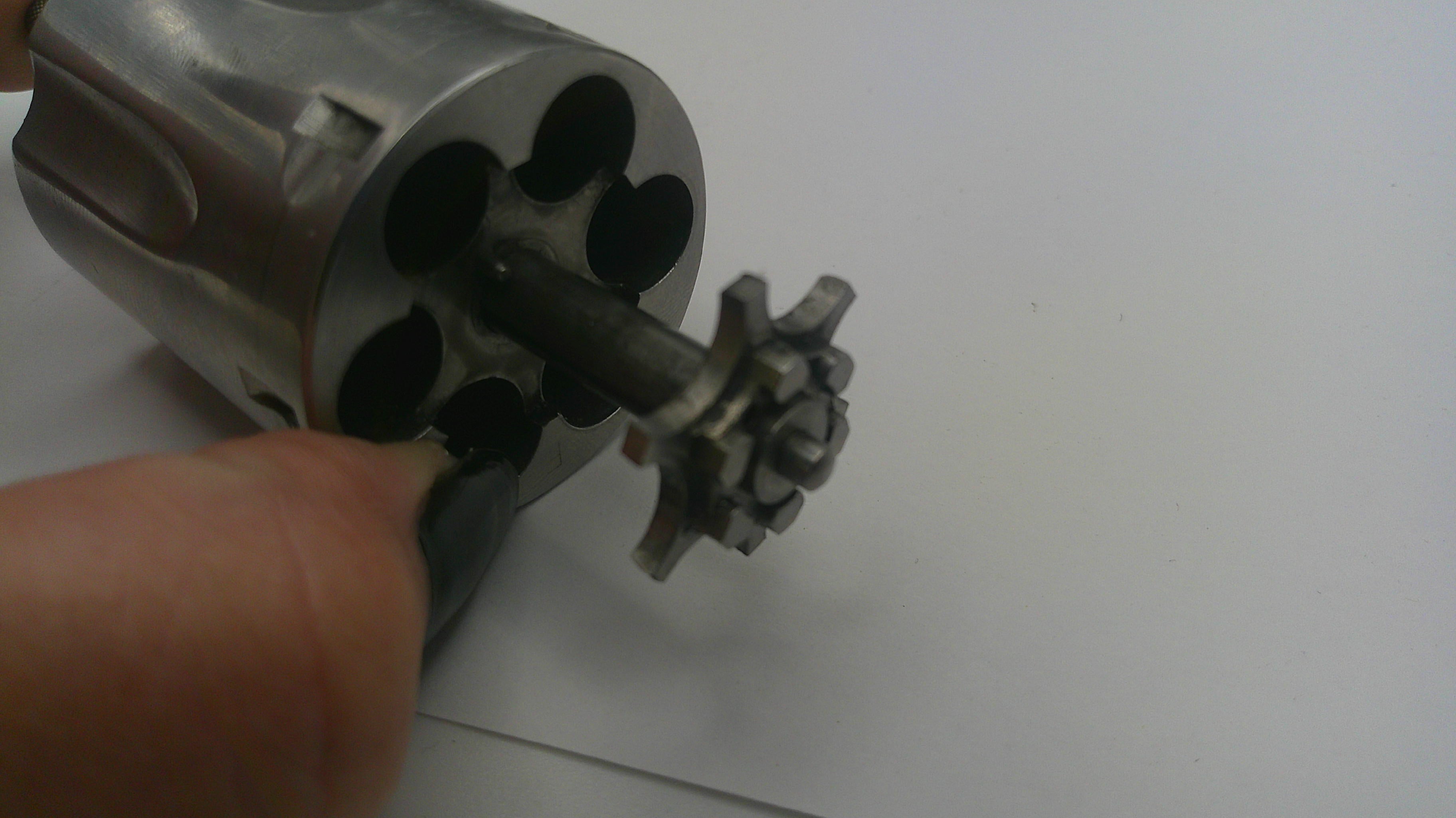 Close-up of a revolver's cylinder on a white background