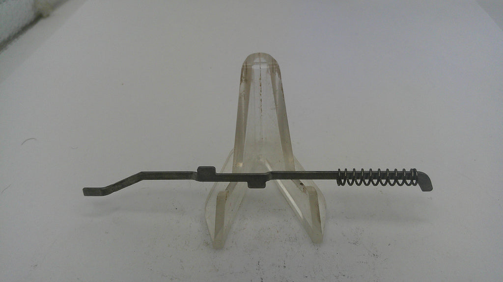 Metal tool with a spring on a white background