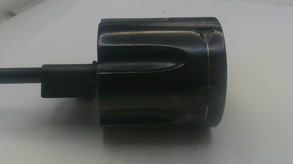 Black cylindrical object with a cable on a white background