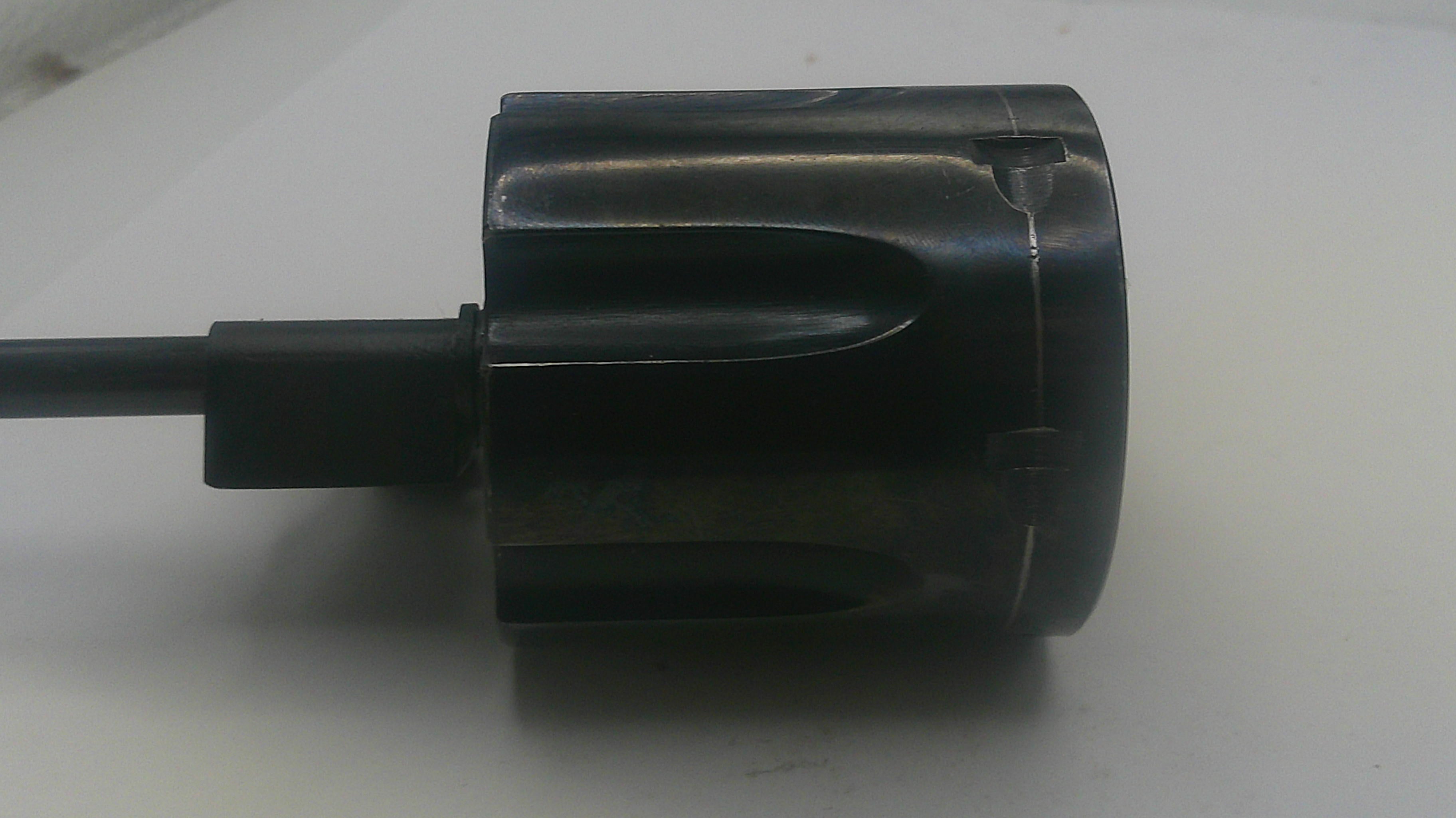 Black cylindrical object with a cable on a white background