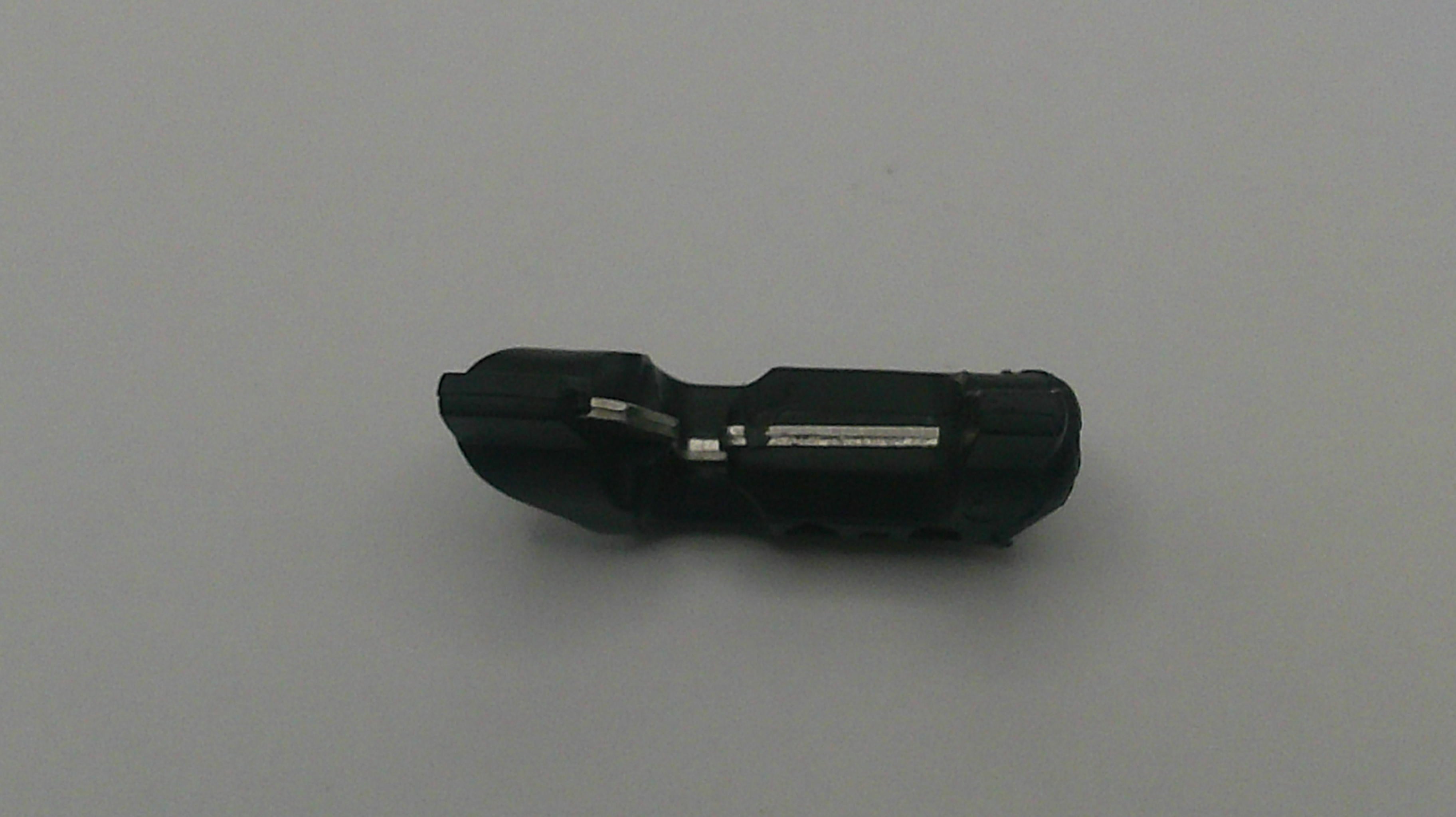 Black electronic component on a gray background