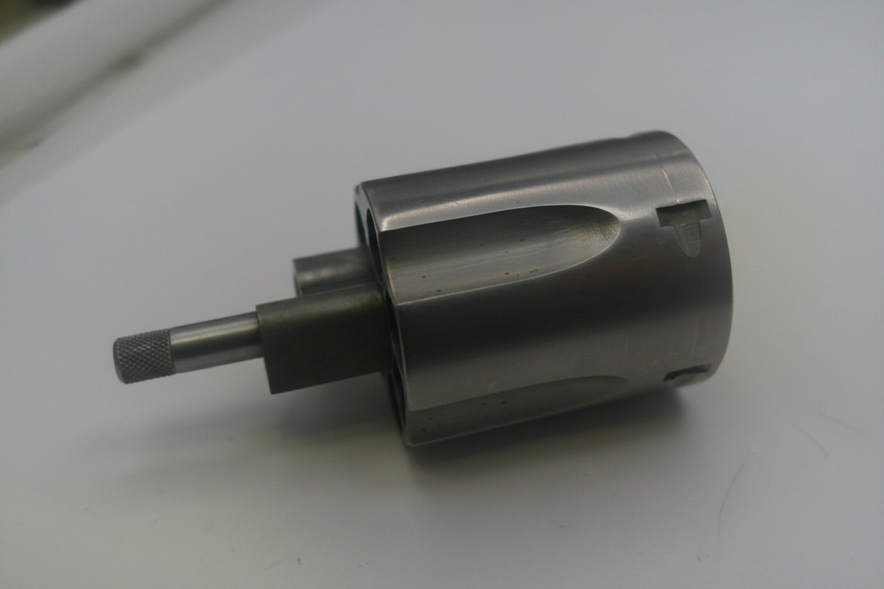 Metal drill bit on a white surface