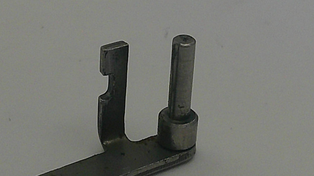 Metal mechanical component on a plain background
