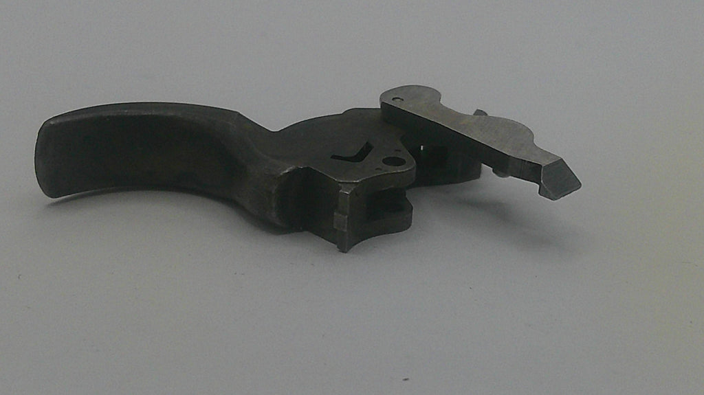 Metal tool or component on a gray background